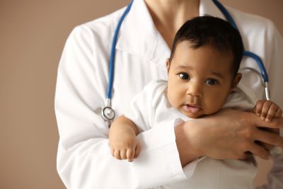 Baby held by a nurse